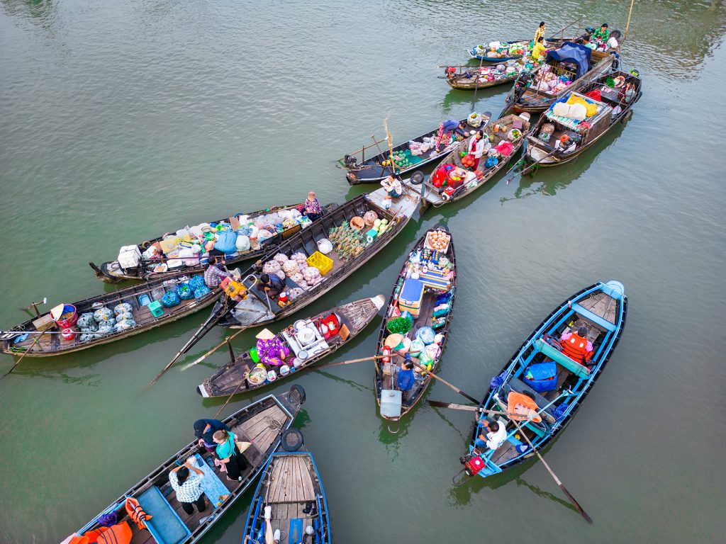 Aerial image of boats in Phone Dien floating market.