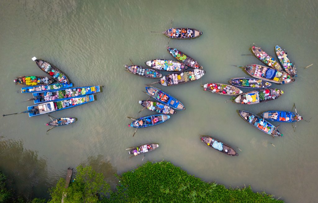 Aerial image of Phong Dien floating market. 24 sampans or small boats clustered together on the Can Tho river.