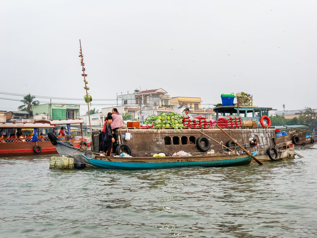 Large merchant boats at Cai Rang floating market.