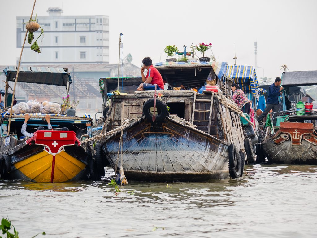 Large merchant boats at Cai Rang floating market.